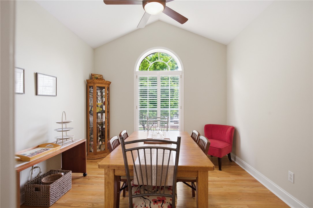 106 Cardinal Drive Seneca, SC 29672 - Photo 16 of 48 This dining area features an arched window, vaulted ceilings, and a neutral color palette.