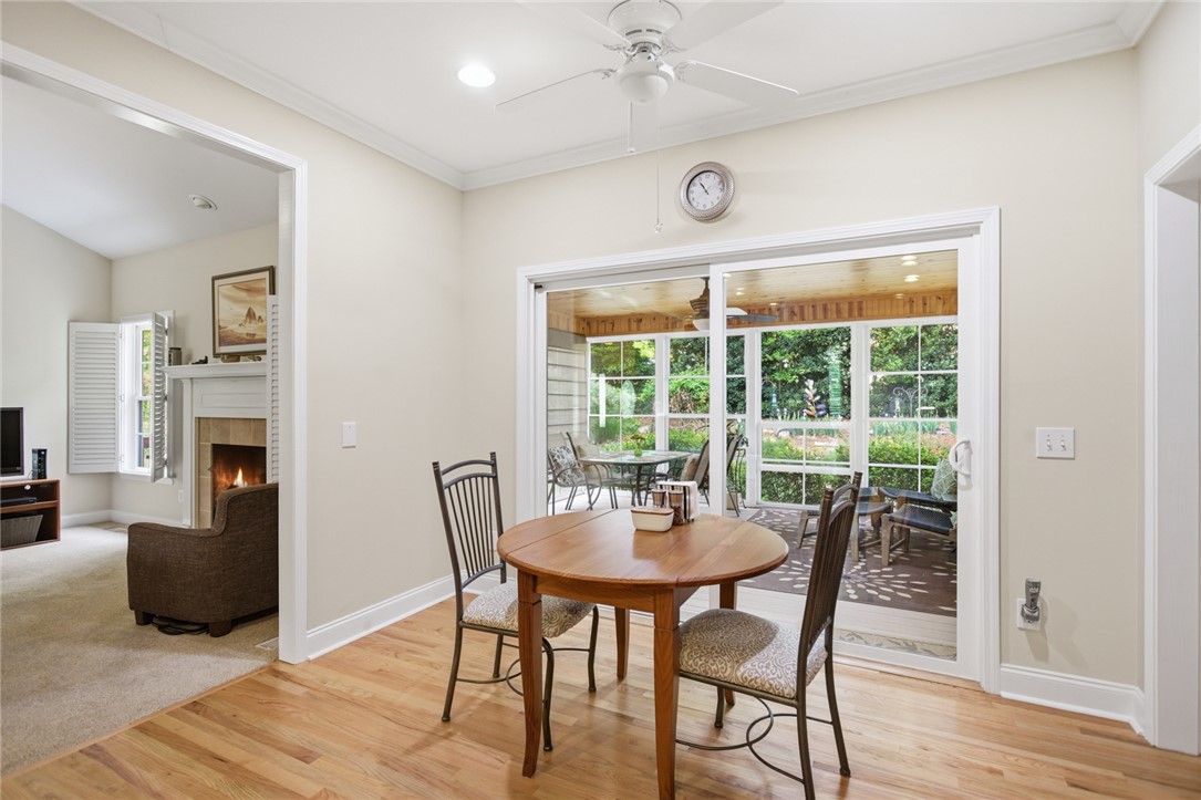 106 Cardinal Drive Seneca, SC 29672 - Photo 17 of 48 This bright breakfast area with hardwood floors opens to a spacious screened porch, perfect for enjoying morning coffee.