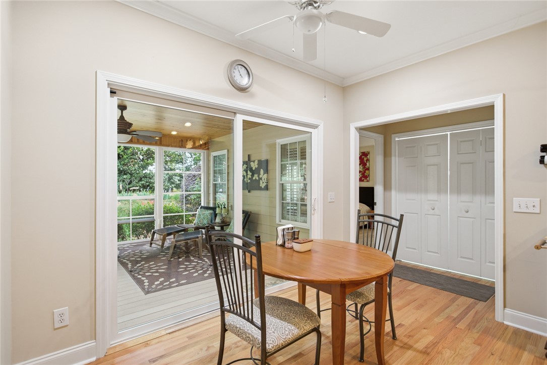 106 Cardinal Drive Seneca, SC 29672 - Photo 18 of 48 This bright breakfast area provides a seamless transition to the serene screened porch, perfect for dining and relaxation.