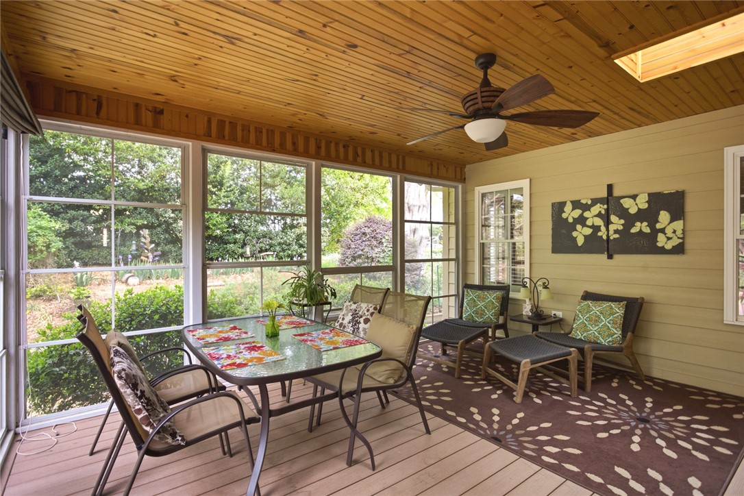 106 Cardinal Drive Seneca, SC 29672 - Photo 21 of 48 Enjoy the peaceful surroundings from this spacious and airy screened porch with wooden ceilings.
