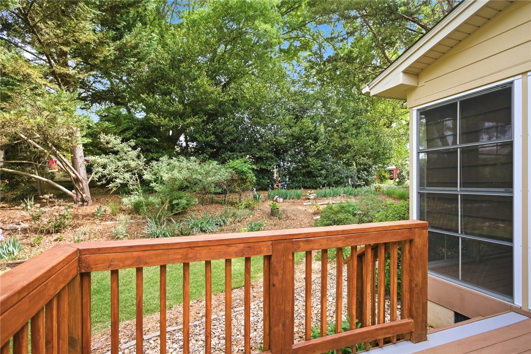 106 Cardinal Drive Seneca, SC 29672 - Photo 24 of 48 This private backyard oasis features mature trees and lush landscaping, offering a tranquil retreat.