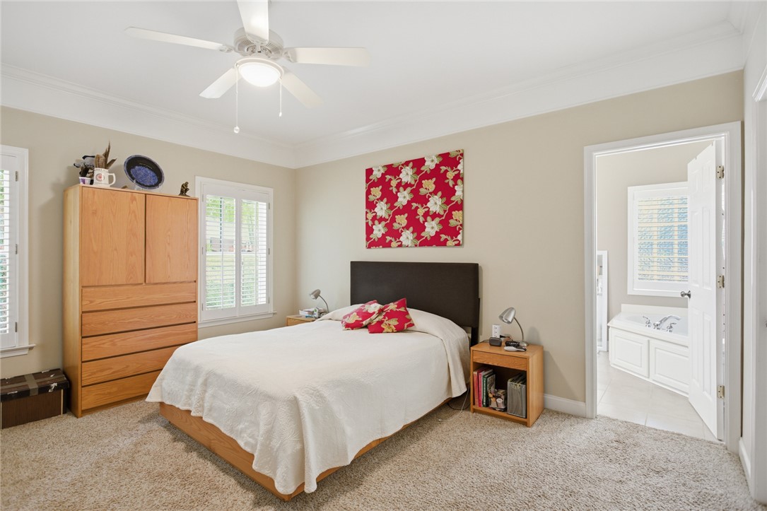 106 Cardinal Drive Seneca, SC 29672 - Photo 26 of 48 This inviting bedroom features soft carpeting, ample natural light, and a functional ceiling fan.