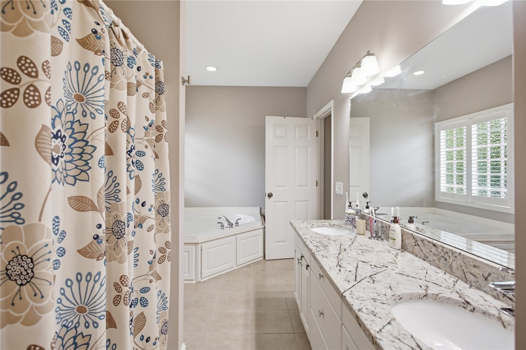 106 Cardinal Drive Seneca, SC 29672 - Photo 29 of 48 This bright bathroom features a spacious vanity and a relaxing soaking tub.
