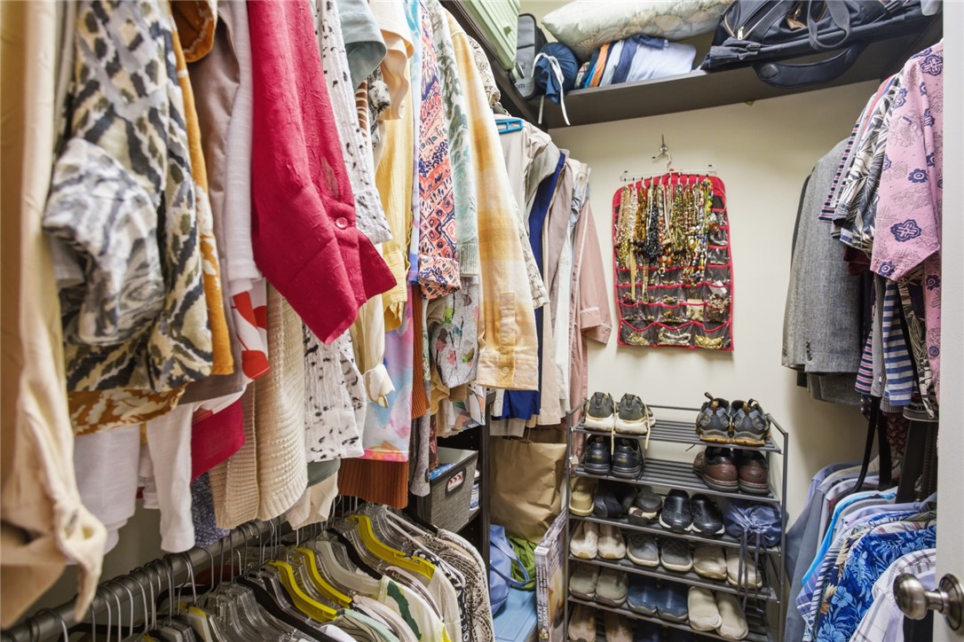 106 Cardinal Drive Seneca, SC 29672 - Photo 31 of 48 This organized walk-in closet maximizes storage with shelving and hanging rods.
