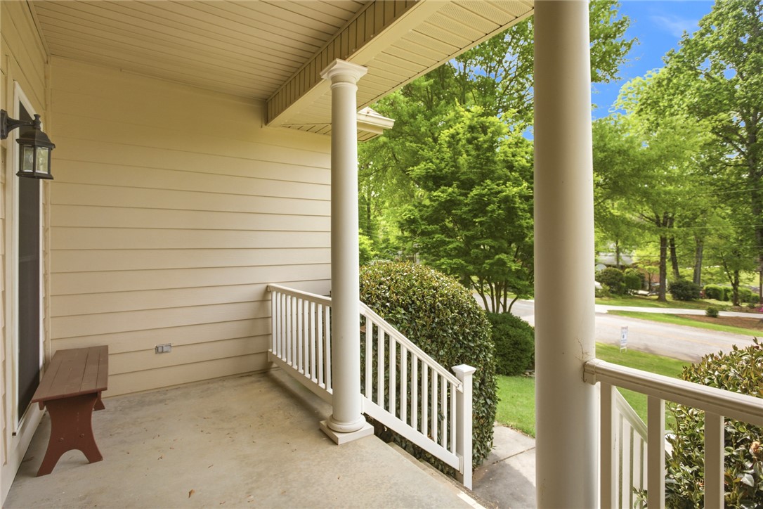 106 Cardinal Drive Seneca, SC 29672 - Photo 36 of 48 Welcome to a charming front porch, offering a serene view of lush greenery and an inviting ambiance.