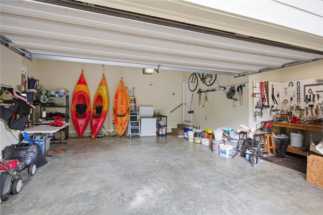 106 Cardinal Drive Seneca, SC 29672 - Photo 37 of 48 This spacious garage offers versatile storage and dedicated workspace.