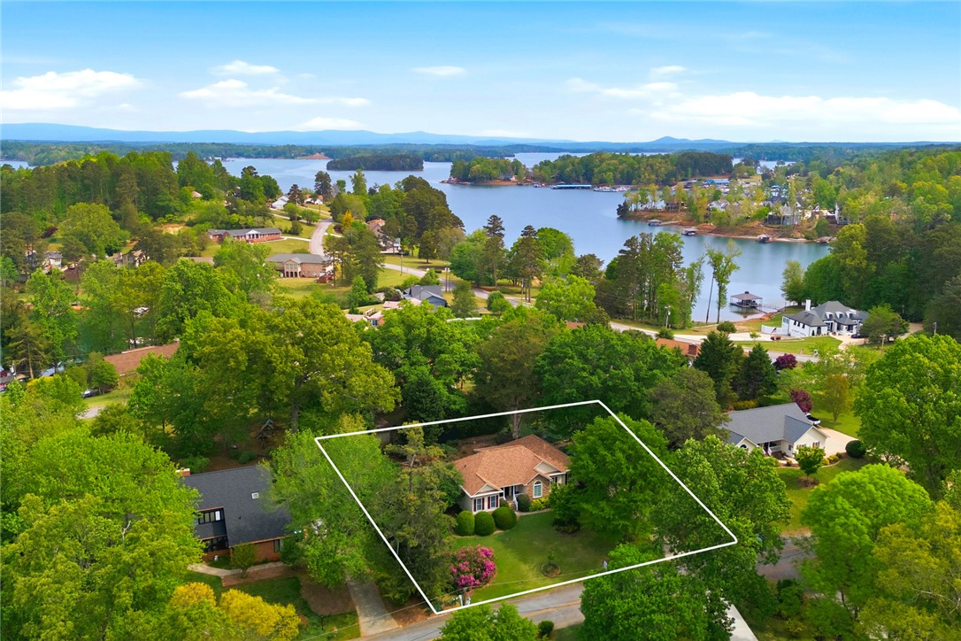 106 Cardinal Drive Seneca, SC 29672 - Photo 44 of 48 This tranquil waterfront home offers a serene escape amidst lush greenery and scenic lake views.