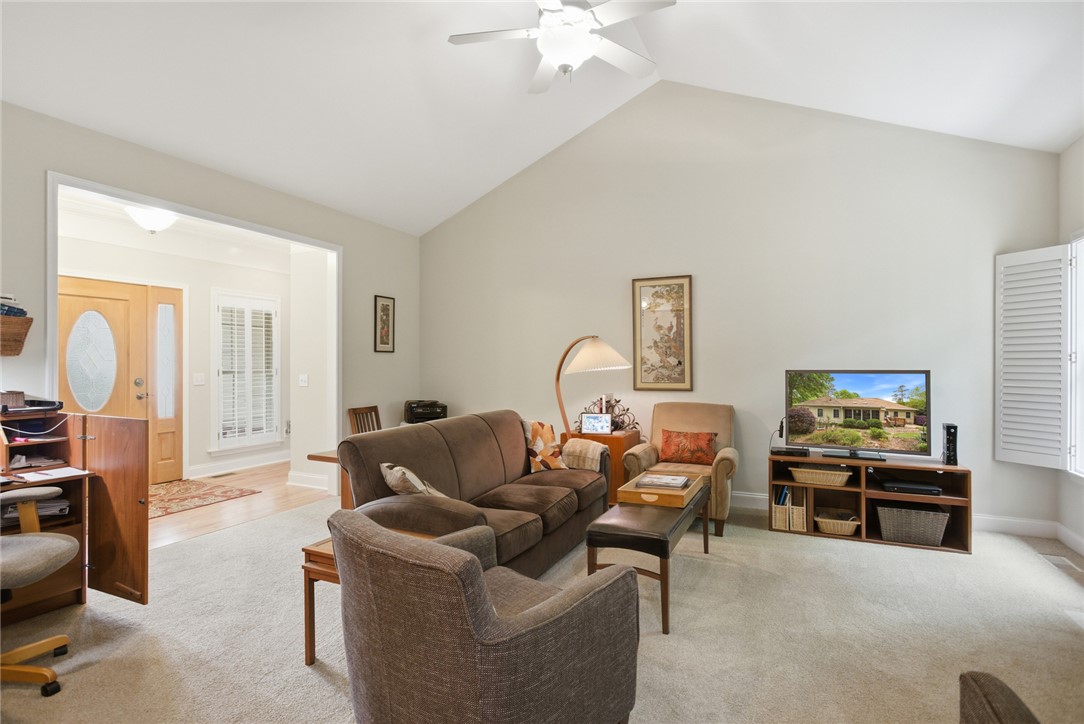 106 Cardinal Drive Seneca, SC 29672 - Photo 6 of 48 This bright living area features vaulted ceilings and carpet flooring, perfect for comfortable living.