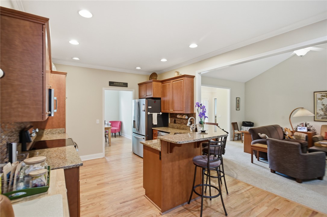 106 Cardinal Drive Seneca, SC 29672 - Photo 9 of 48 This kitchen features sleek countertops and modern appliances, seamlessly flowing into an inviting living space.
