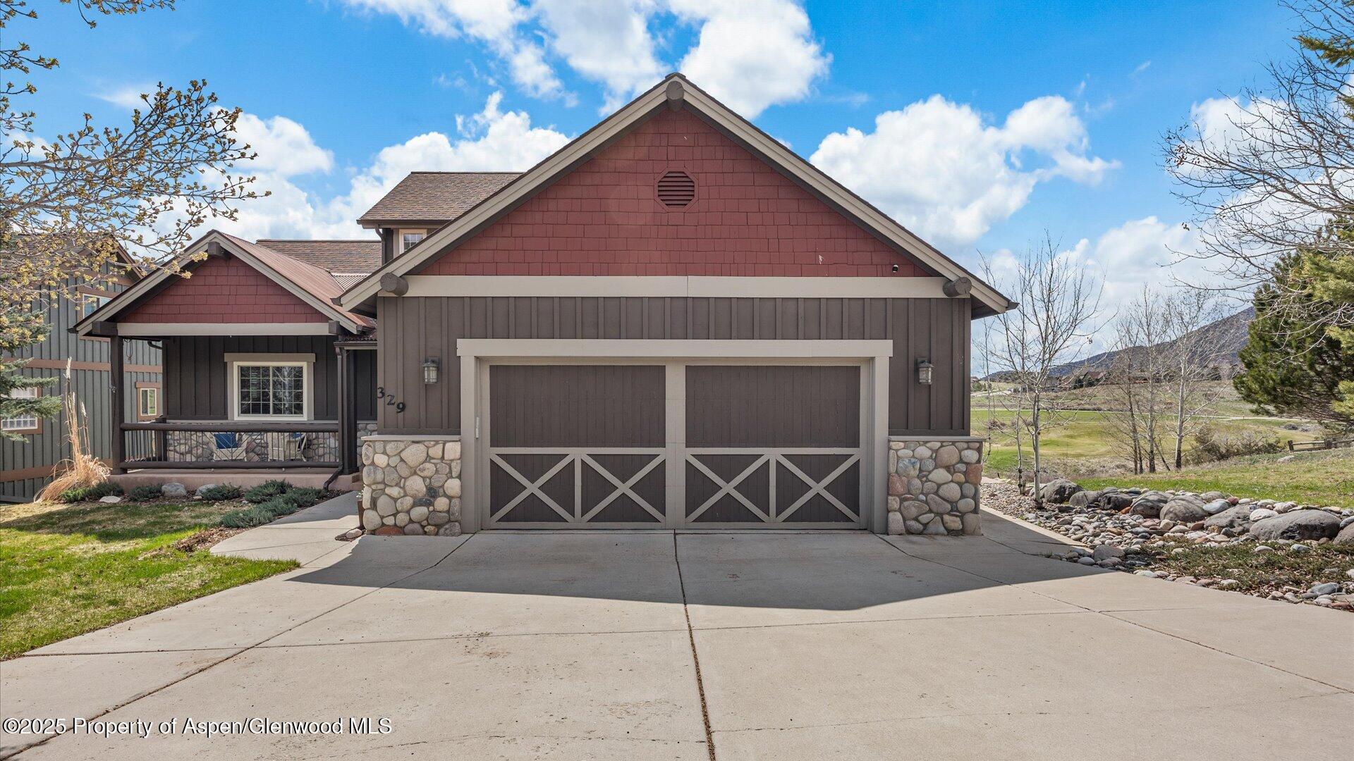 a front view of a house with parking area