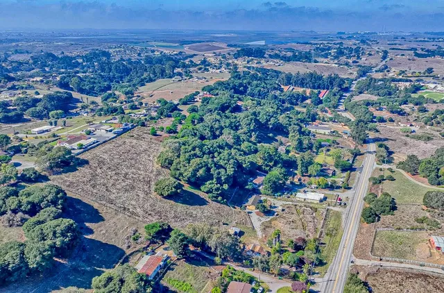 an aerial view of a city and mountain