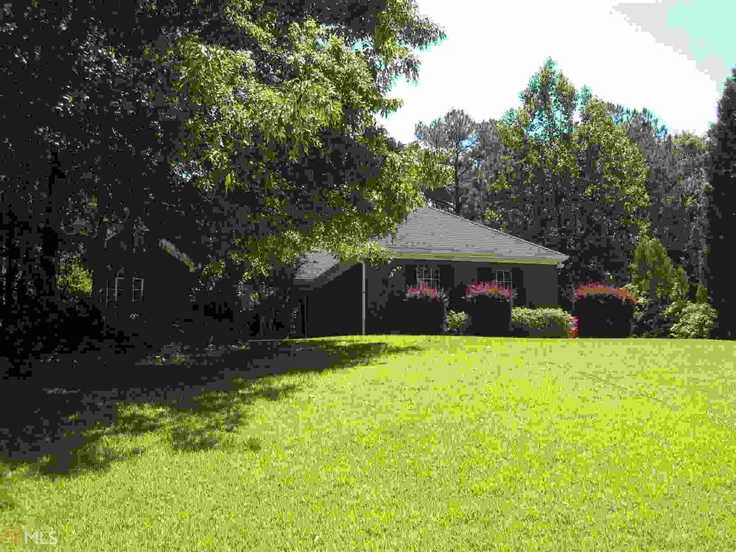 90 Riverside Court Sharpsburg, GA 30277 - Photo 1 of 1 a front view of a house with a yard