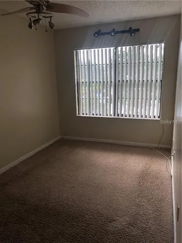 a white toilet sitting next to a bath tub and a shower