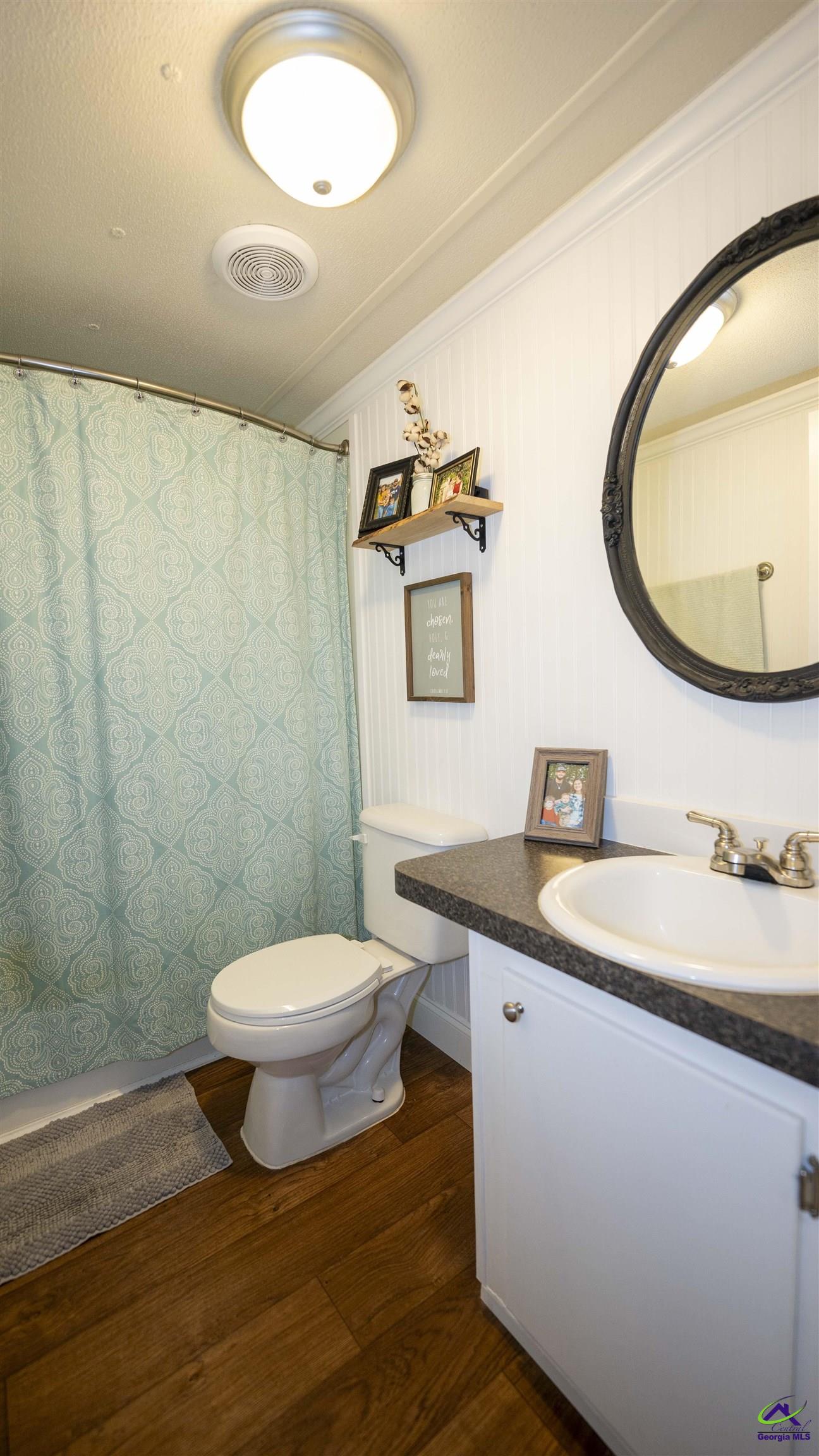500 Old Milledgeville Road Cochran, GA 31014 - Photo 46 of 48 a bathroom with a granite countertop toilet sink and mirror