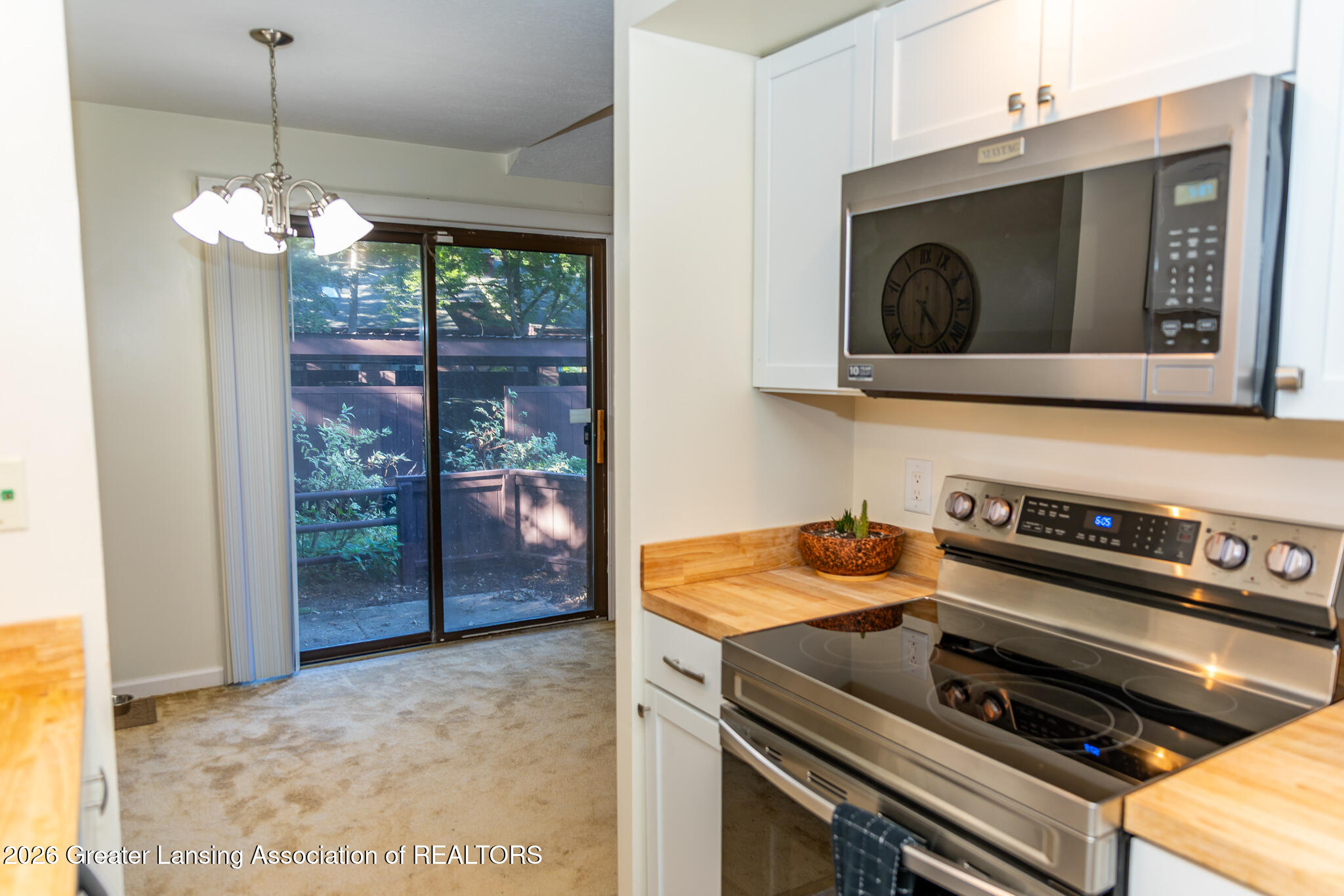 101 East Jolly Road, Unit B8 24 Lansing, MI 48910 - Photo 14 of 43 Leaving kitchen