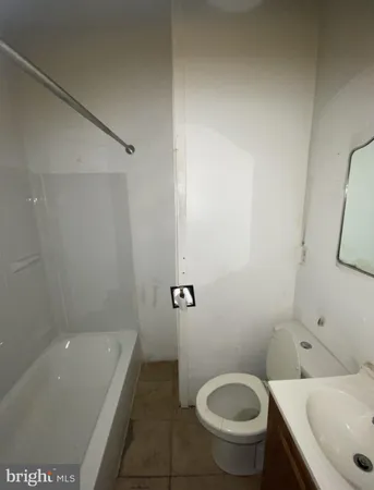 a bathroom with a sink and toilet