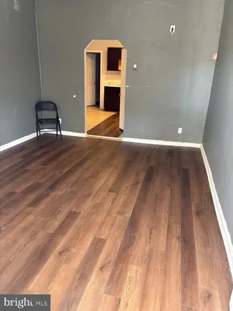 a view of room with wooden floor