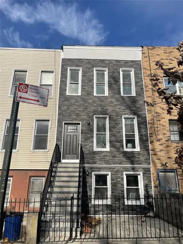 a front view of a building with glass windows