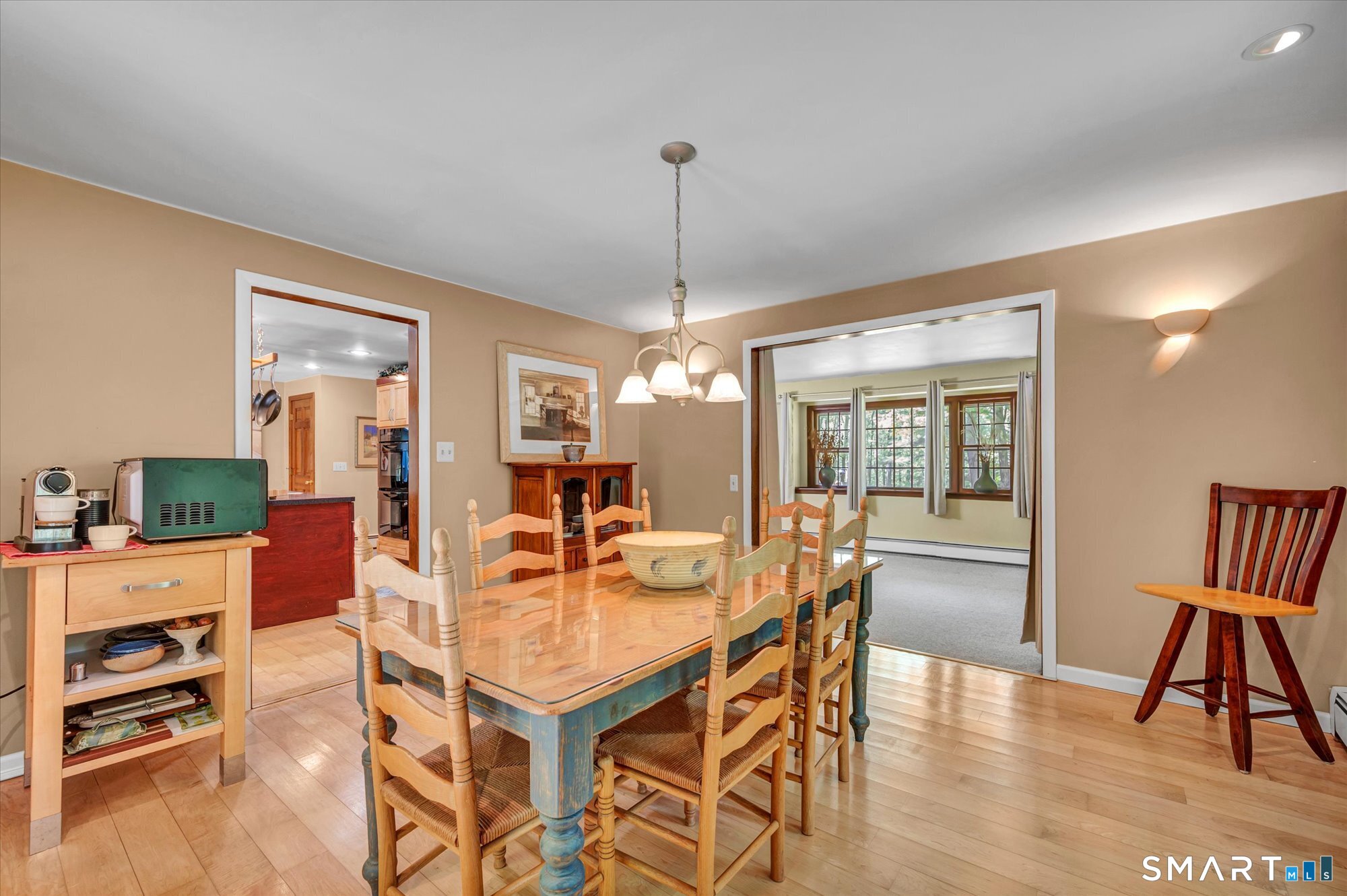 59 Indian Hill Road Canton, CT 06019 - Photo 9 of 39 a dining room with furniture a chandelier and wooden floor