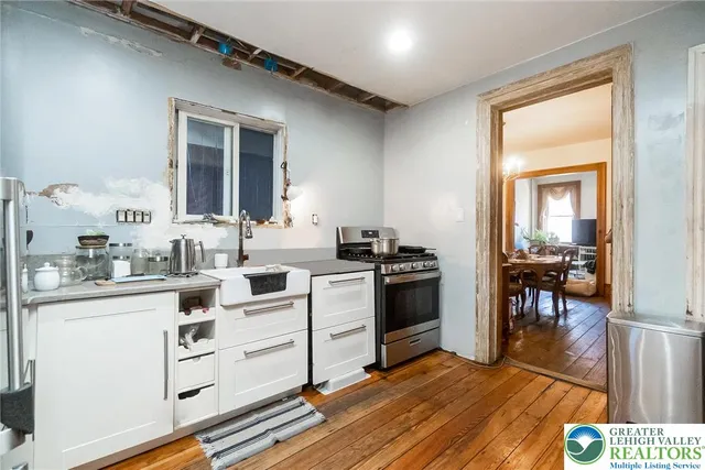 a kitchen with a window a sink and a cabinets