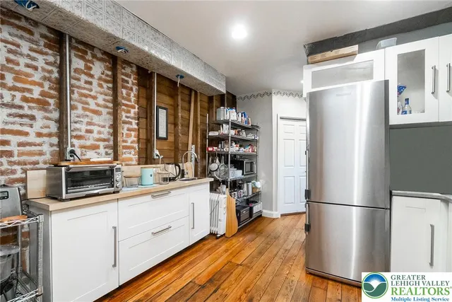 a white toilet sitting next to a bathroom sink