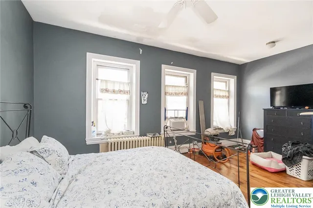 a bedroom with furniture and a chandelier