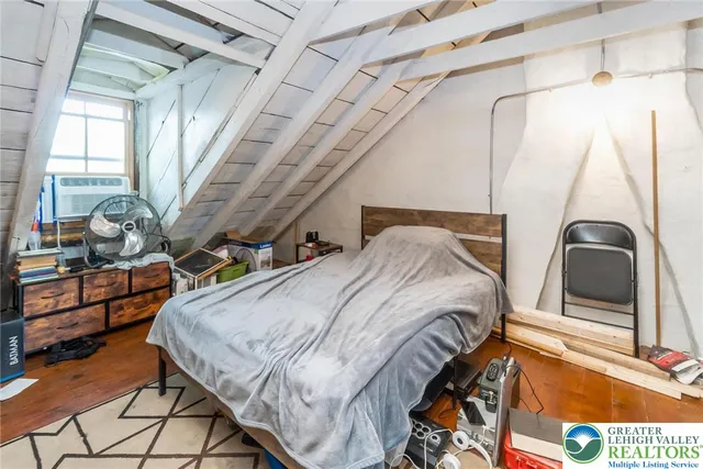 a view of a room with wooden furniture