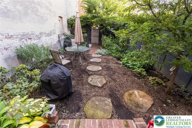 a view of a building with potted plants