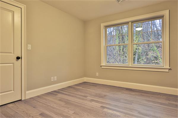 25 Robinson Road Lexington, MA 02420 - Photo 16 of 29 an empty room with wooden floor and windows
