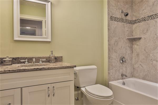 25 Robinson Road Lexington, MA 02420 - Photo 18 of 29 a bathroom with a granite countertop sink a toilet and shower