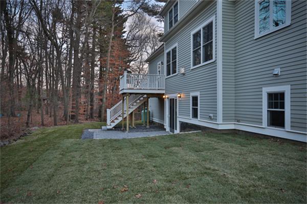 25 Robinson Road Lexington, MA 02420 - Photo 27 of 29 a view of a house with a yard and a tree