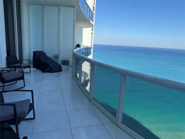 a bedroom with a bed and a chair