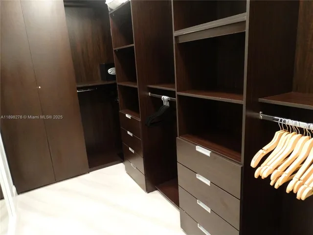 a bathroom with a shower and a sink