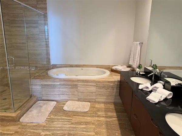 a view of staircase with white walls and a window