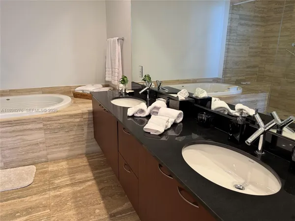 a front view of a room with balcony and furniture