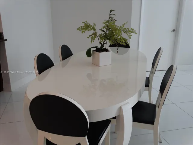 a close view of table chair and potted plant
