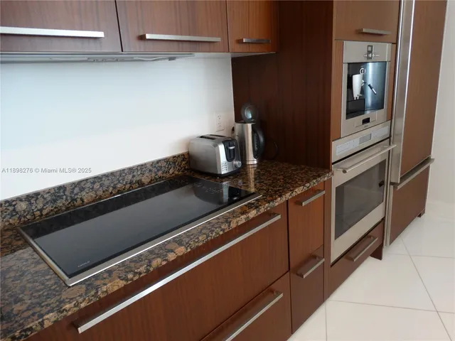 a close view of stove and microwave