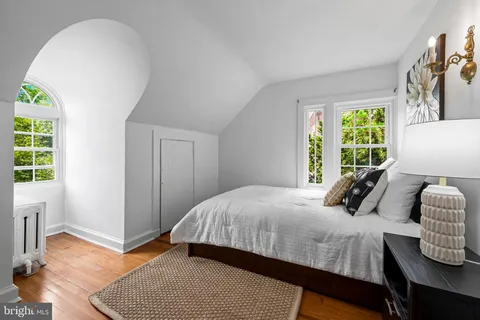 an empty room with a empty space and windows