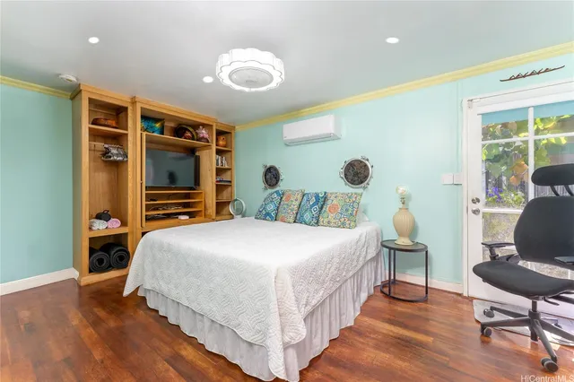 a bedroom with a bed and a chair