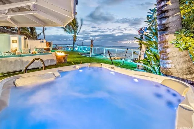 a view of a swimming pool with a patio and a yard