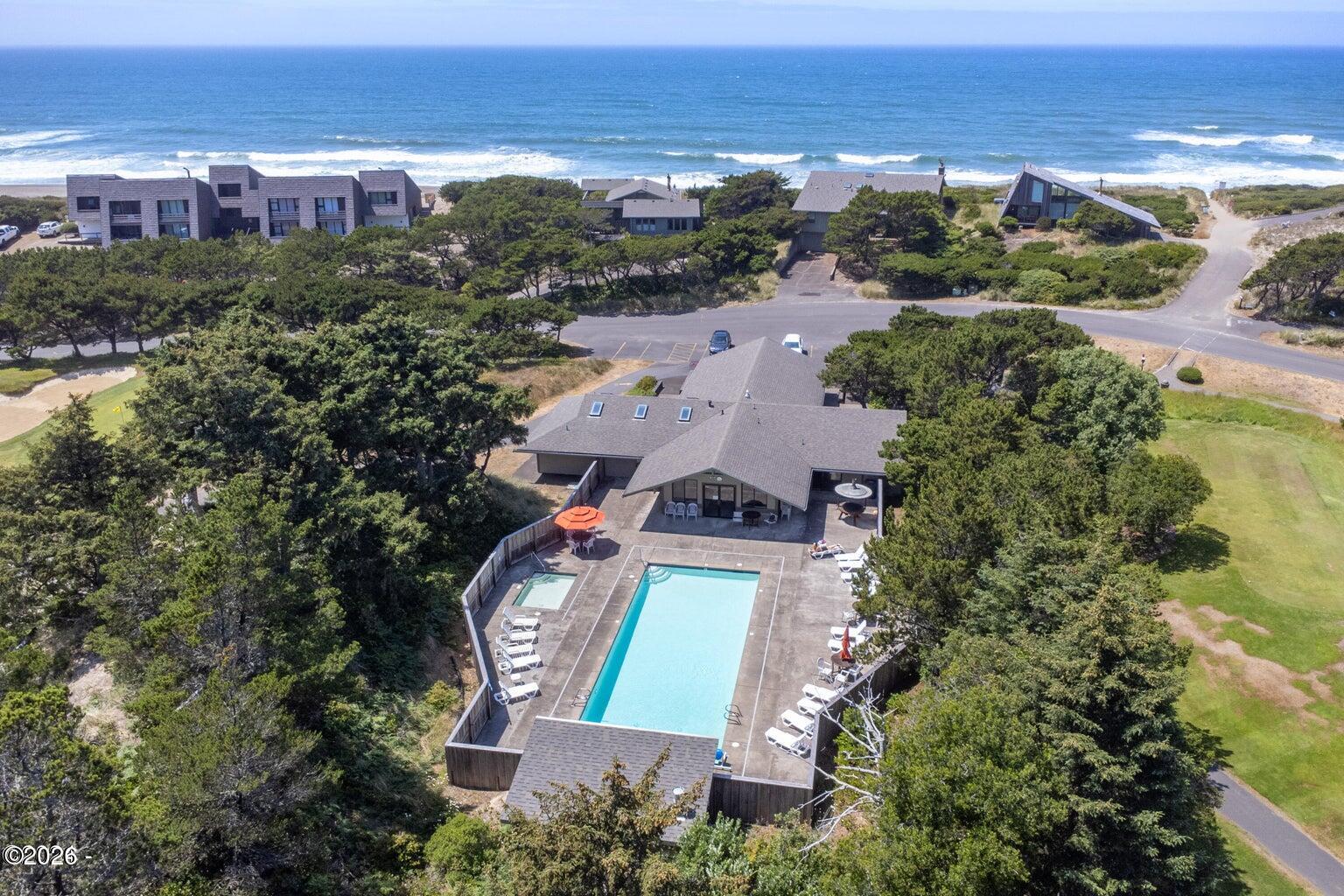 142 East Bay Point Road Gleneden Beach, OR 97388 - Photo 45 of 49 an aerial view of a house with a garden