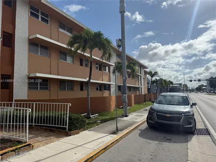 a view of a car park in front of house