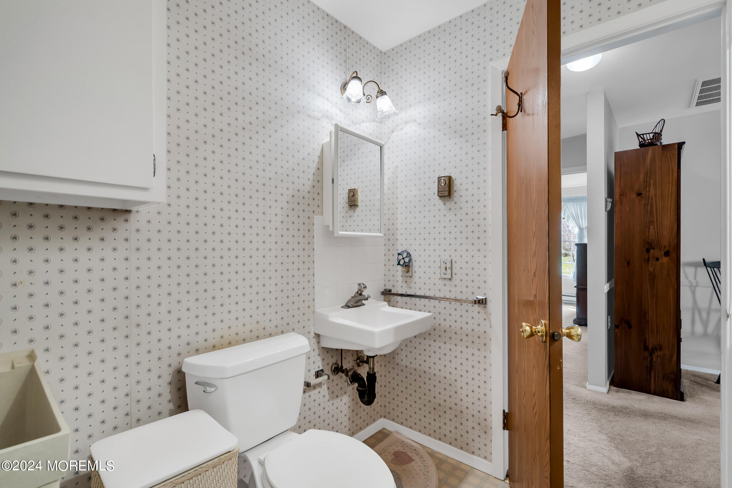 7 Amherst Road, Unit C Manchester Township, NJ 08759 - Photo 20 of 25 a bathroom with a toilet sink shower and mirror