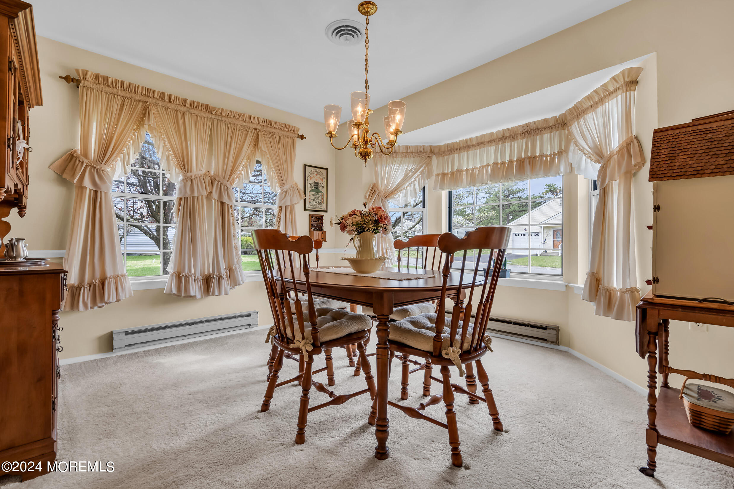 7 Amherst Road, Unit C Manchester Township, NJ 08759 - Photo 8 of 25 a view of a dining room with furniture window and wooden floor