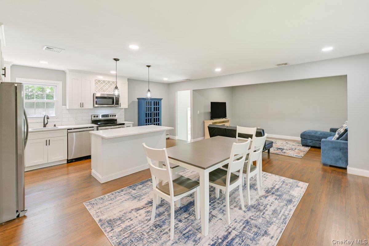 2 Fairview Road Hampton Bays, NY 11946 - Photo 4 of 17 Dining area open to kitchen and living spaces