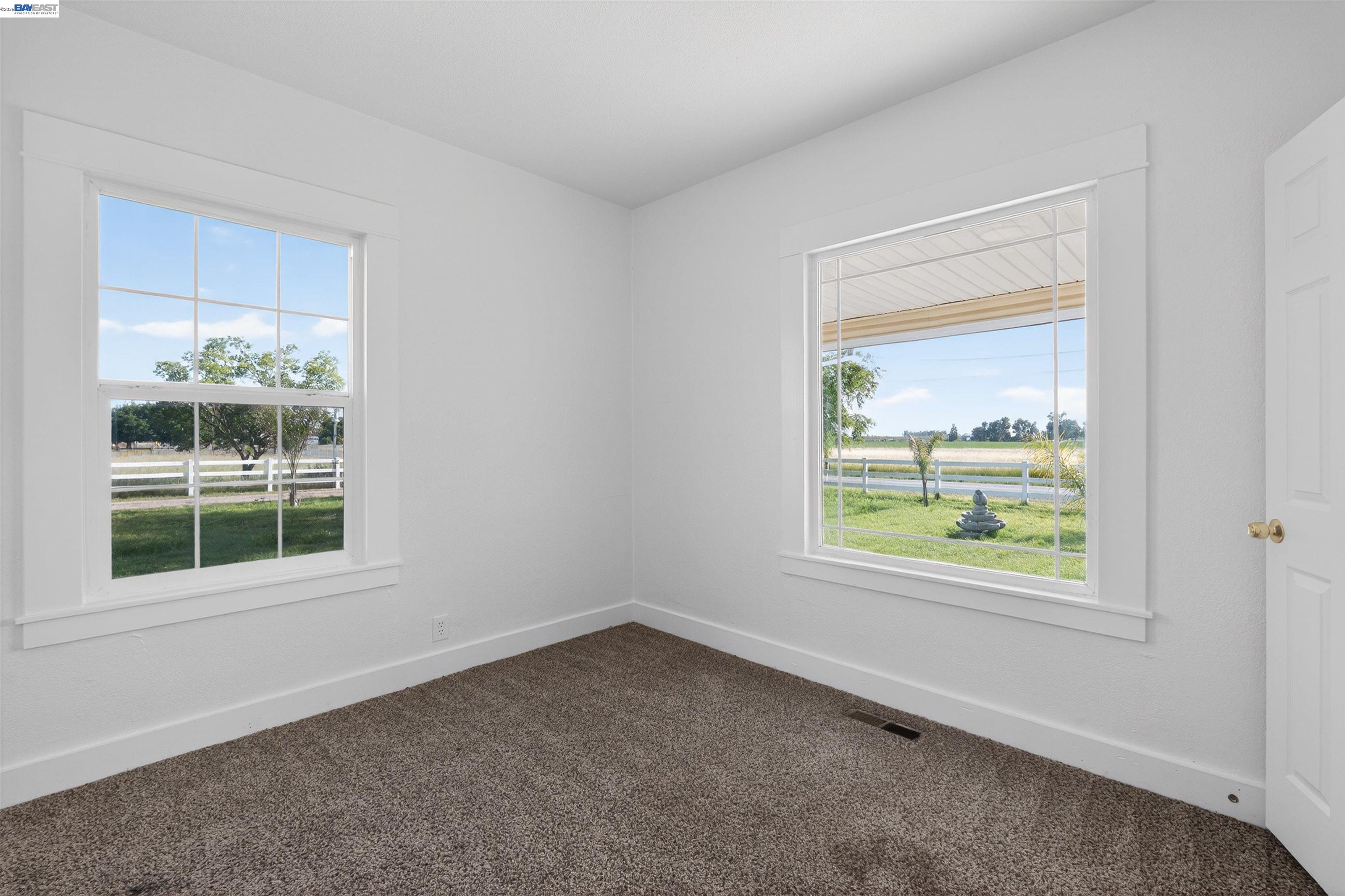 3015 Point Pleasant Road Elk Grove, CA 95757 - Photo 12 of 32 an empty room with a window