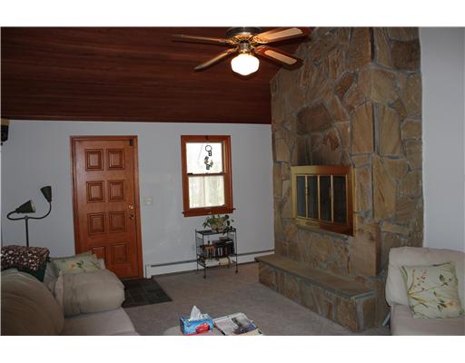 20 Rogler Farm Road Smithfield, RI 02917 - Photo 4 of 14 Den/Family/Great Room. A room that everyone in the family can use. A media/family room with sliding doors leading to the rear deck, a beautiful wood cathedral ceiling and a stunning flagstone fireplace that will keep you warm on those winter nights.