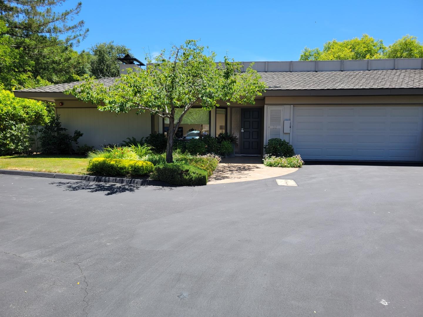 32 Deep Well Lane Los Altos, CA 94022 - Photo 1 of 2 a front view of a house with a yard and garage