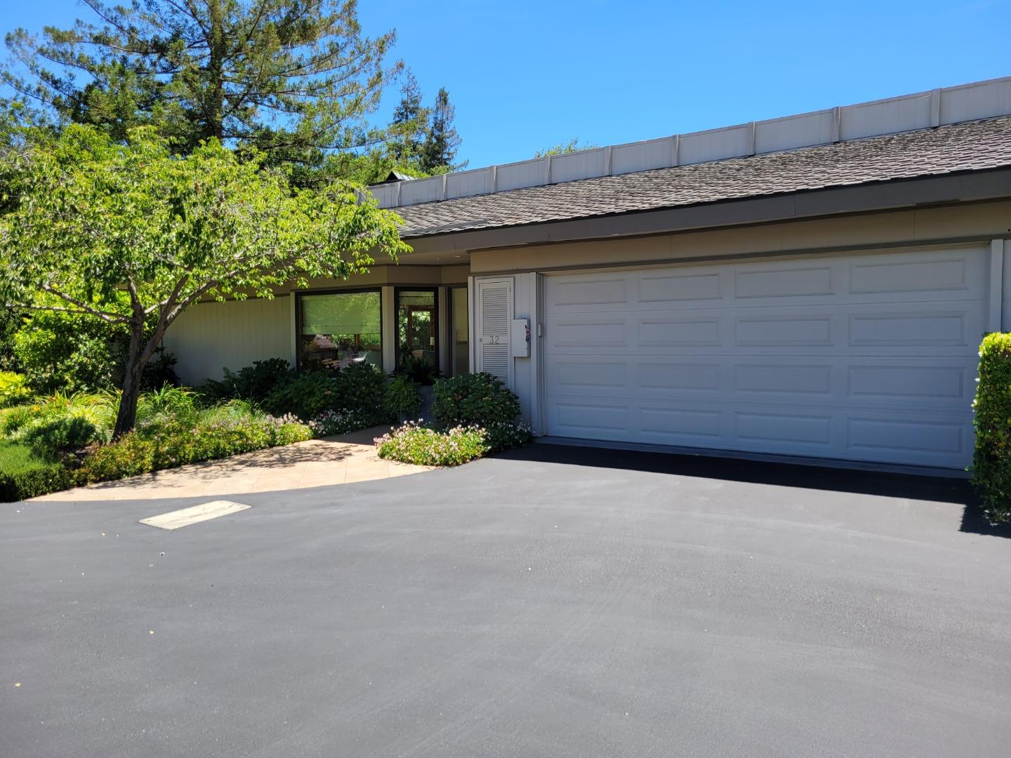 32 Deep Well Lane Los Altos, CA 94022 - Photo 2 of 2 a backyard of a house with plants and trees