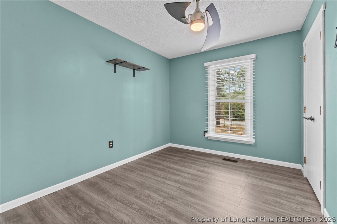 237 Lemuel Black Road Bunnlevel, NC 28323 - Photo 10 of 37 an empty room with a window
